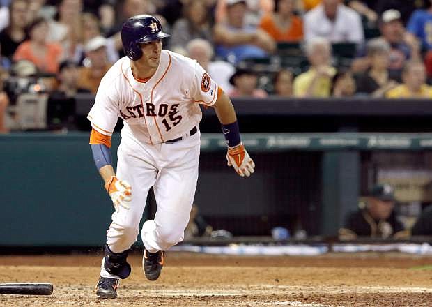 Houston Astros&#039; Jason Castro heads up the first base line on an RBI-single against the Oakland Athletics in the eighth inning of a baseball game on Saturday, April 26, 2014, in Houston. (AP Photo/Pat Sullivan)