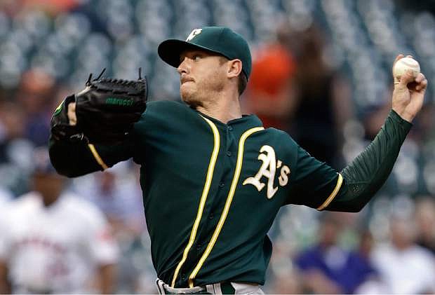 Oakland Athletics&#039; Scott Kazmir delivers a pitch against the Houston Astros in the first inning of a baseball game Thursday, April 24, 2014, in Houston. (AP Photo/Pat Sullivan)