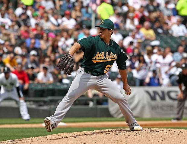 Oakland Athletics starting pitcher Tommy Milone throws to the Chicago White Sox during the first inning in a baseball game on Saturday, June 8, 2013. (AP Photo/Charles Cherney)