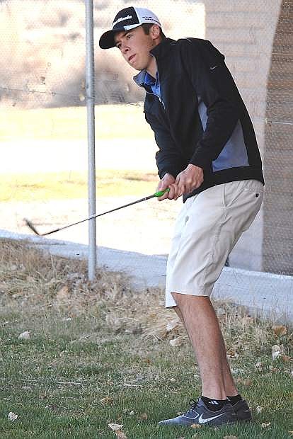 Fallon senior Corbin Waite chips on to the green during a practice round.
