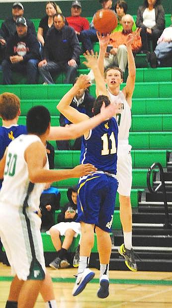 Fallon&#039;s Jeff Evett shoots over a Lowry defender during Saturday&#039;s loss at the Elmo Dericco Gym.
