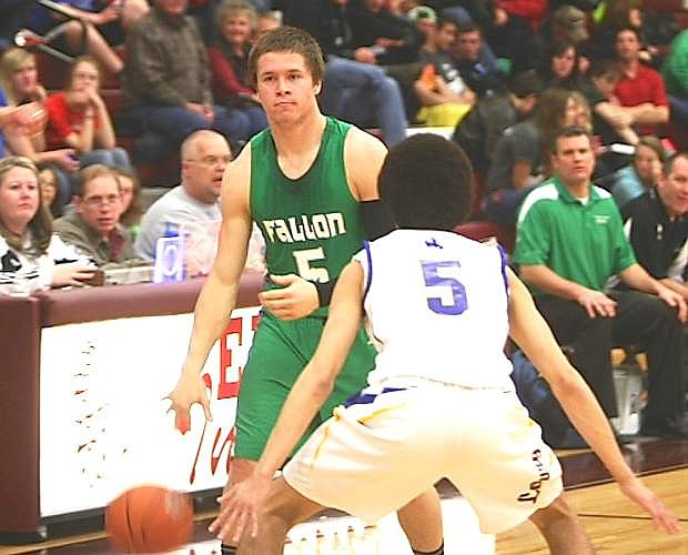 Fallon guard Tyler Bagby dribbles while being defended by Lowry&#039;s Josh Shaver Friday in Elko. The Wave lost 58-41.