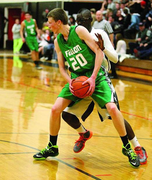 Fallon&#039;s Jeff Evett is guarded by Douglas&#039; Sam Broersma during their game on Saturday.