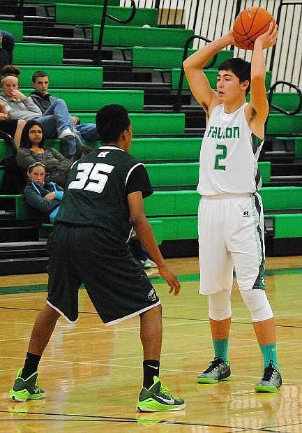 Fallon junoir guard Connor Richardson scans the court during the Wave&#039;s 67-40 win over Hug on Monday at the Elmo Dericco Gym. Richardson had a game-high 17 points.
