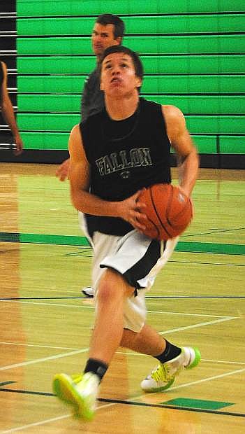Fallon guard Tyler Bagby drives to the basket during a drill in practice.