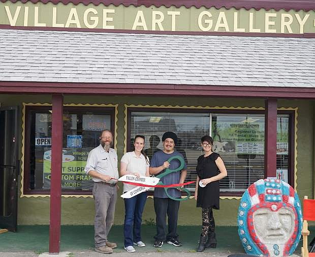 From left, Grant Mills, Keri Renteria, Chris Renteria and Natalie Parrish participate in the grand opening of the Village Art Center, which opened a music department.