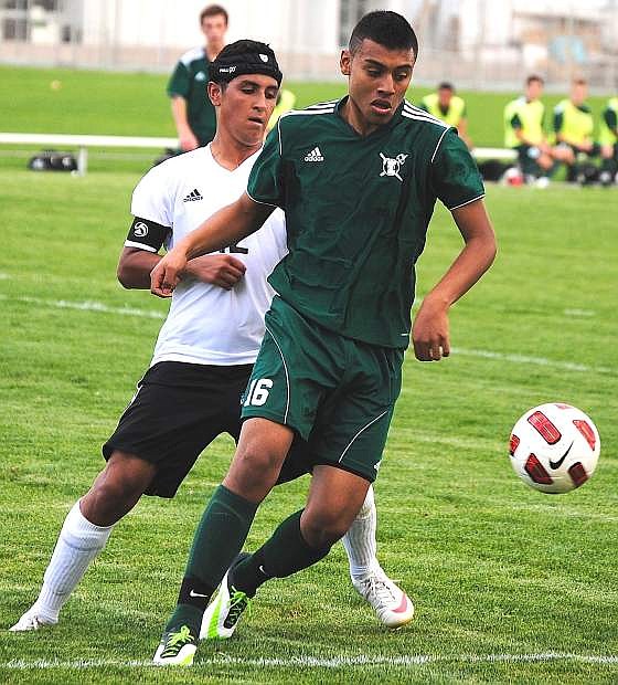 Incline&#039;s Ray Estrada works against Fallon&#039;s Austin Bischoff during Wednesday&#039;s match. Incline won, 3-0.