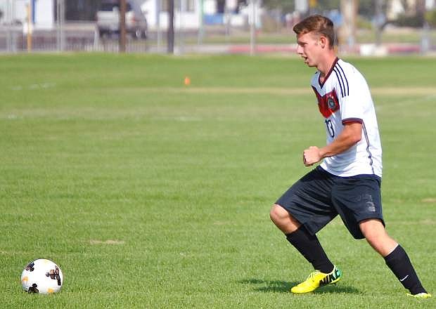 Fallon soccer player Trevor Davis scoops up a loose ball during practice last week.