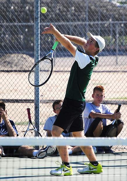 Wave senior Tyler Wood serves during practice last week. He and doubles partner Martin Beyer are two-time Division I-A state qualifiers.