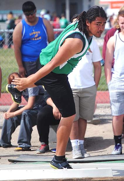 Fallon sophomore follows through during a throw in the shot put. Mauga took fifth in the shot put and second in the discus.