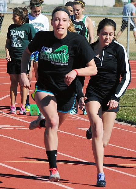 Fallon standout Elena Murrya, left, and Taylor Bright take part in sprints during practice.