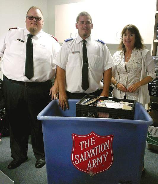 Shown from the left is Lt. Mark Cyr; Matt Carboni, Salvation Army youth pastor; and Peggy Sweetland, special projects coordinator with the Carson City School District.