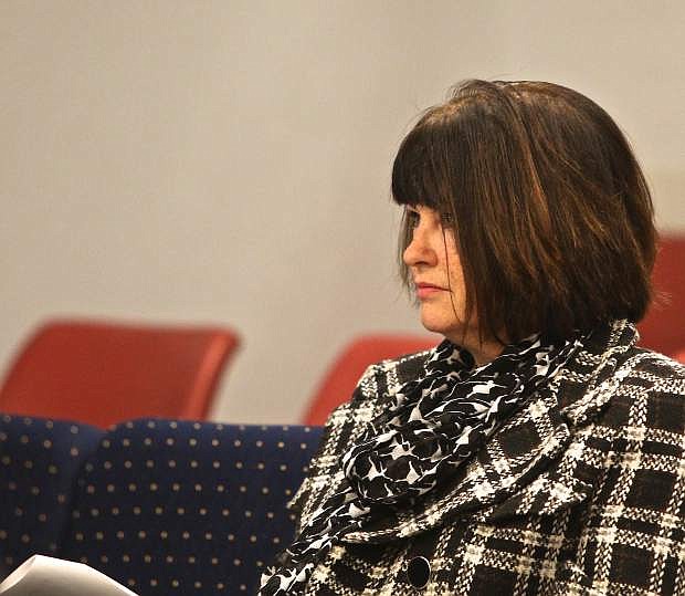 Lori Bagwell studies her notes at a recent Carson City Board of Supervisors meeting.
