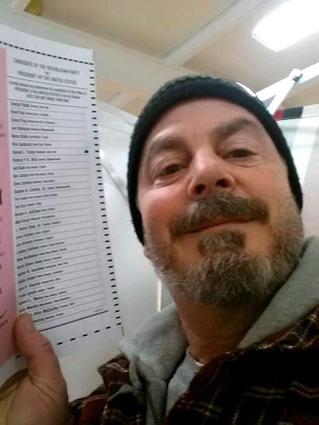 In this Feb. 9, 2016, photo, provided by Bill Phillips, of Nashua, N.H., Phillips takes a selfie with his marked election ballot. The secrecy of the voting booth may soon be a thing of the past. Ballot selfies, where people use smartphones to photograph and share their marked ballots online, are becoming more common, as voters young and old look to share their views with family, friends and the world. But what they don&#039;t realize is they may be breaking the law, depending on where they live. (Bill Phillips via AP)