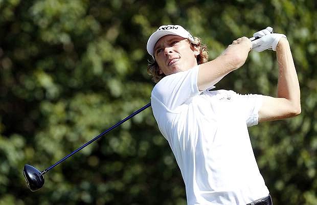 Will Wilcox watches his tee shot on the 16th hole during the second round of the Barbasol Championship golf tournament, Friday, July 17, 2015, in Opelika, Ala. (AP Photo/Butch Dill)