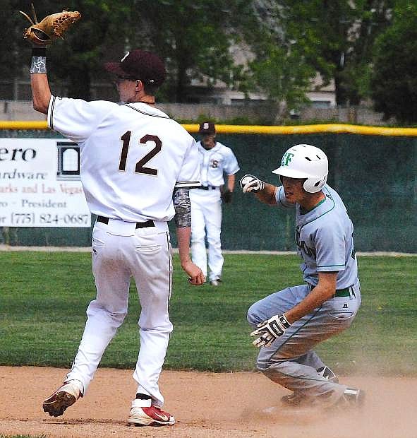 Marshall Coverston, right, steals second base for Fallon in a game against Sparks on Saturday.