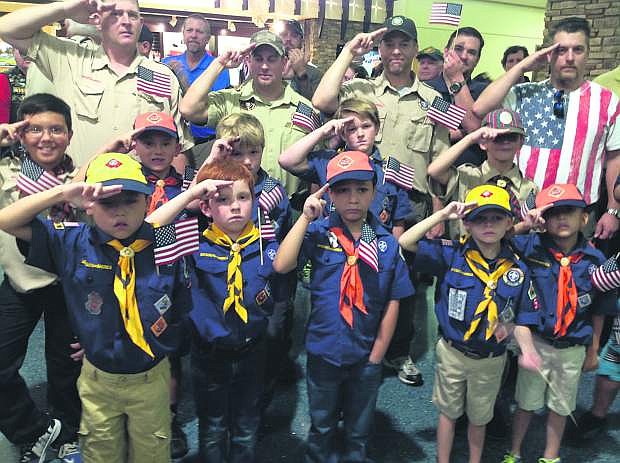 Cub Scouts with their proud dads at Reno Tahoe Airport saluting returning Honor Flight Nevada Vets on Sunday.