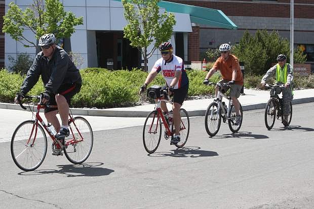 Nevada National Guard member Tom McElroy leads his team on a lunch time bike ride Friday afternoon as part of Bike to Work Week.