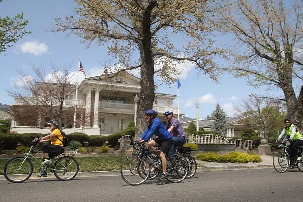 City Manager Nick Marano, center, rides by the Governor&#039;s Mansion while participating in the annual celebrity bike ride earlier this year.