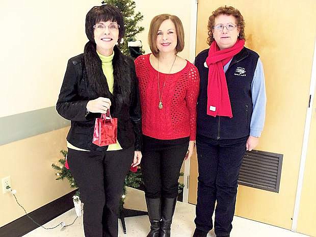From left: Janice McIntosh, Victoria Williams and Valerie Wyman donated Walmart gift card to Carson City Senior Services in December.
