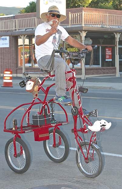 Ed Fruend rides his tall bike at the Blinkyman Ride Saturday evening in Carson City.