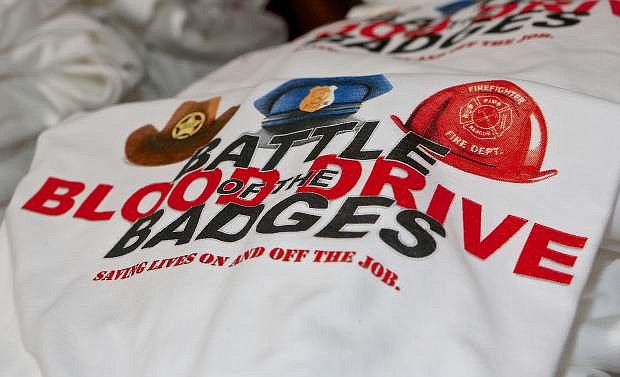 Blood-givers received a &#039;Battle of the Badges&#039; t-shirt Wednesday.