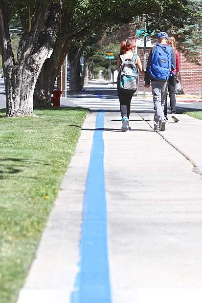 Schoolchildren walk alongside the Kit Carson Trail, aka &#039;blue line trail&#039;, in front of Bordewich-Bray Elementary School Friday in Carson City.