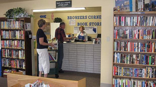 Customers Jan and Bill Bachman buy books from volunteer Sylvia Winters at the Browsers Corner Book Store, which helps fund the Carson City Library.