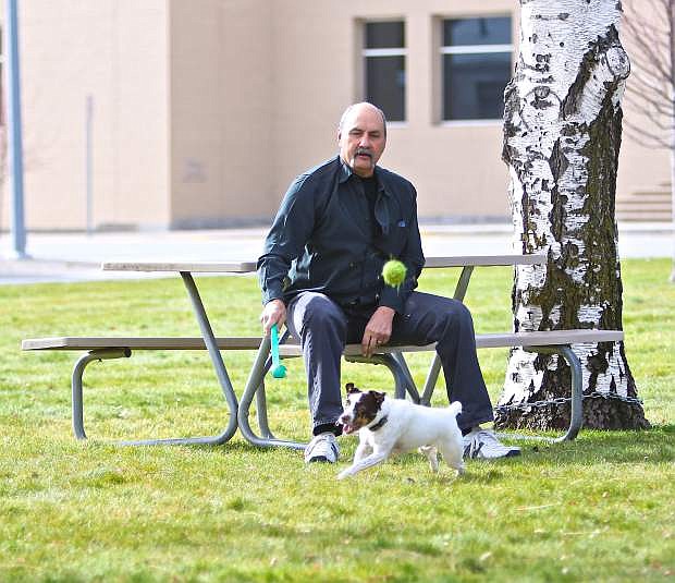 Dan Wilson of Carson City uses a &#039;Chukit&#039; to throw a tennis ball near downtown for his Jack Russell Terrier &#039;Bowtie&#039; on an unusually balmy Thanksgiving Day. Temperatures were expected to be near 70 degrees.