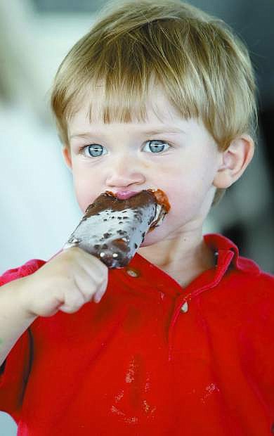 Greyson Griffin eats an ice cream at the 2012 Kids Auction &amp; World&#039;s Greatest BBQ fundraiser for the Boys &amp; Girls Clubs of Western Nevada.