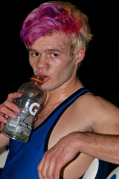 138 pound Carson wrestling standout Brady O&#039;Keefe rehydrates after a match Wednesday at CHS.