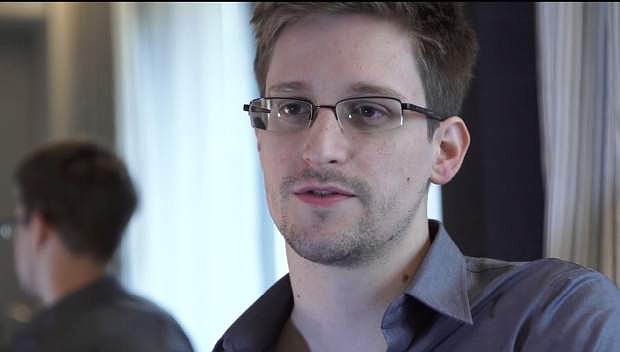 FILE - This Sunday, June 9, 2013 file photo provided by The Guardian Newspaper in London shows Edward Snowden, in Hong Kong. Snowden has left Moscow&#039;s Sheremetyevo airport and entered Russia his lawyer said on Thursday Aug. 1, 2013. (AP Photo/The Guardian, Glenn Greenwald and Laura Poitras, File)