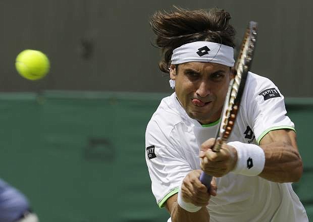David Ferrer of Spain returns to Ivan Dodig of Croatia in their Men&#039;s singles match at the All England Lawn Tennis Championships in Wimbledon, London, Monday, July 1, 2013. (AP Photo/Anja Niedringhaus)