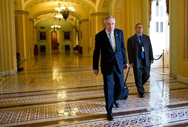 Senate Majority Leader Sen. Harry Reid, D-Nev., walks to his office after arriving on Capitol Hill on Wednesday, Oct. 16, 2013 in Washington. Aides to Senate Democrat Majority Leader Harry Reid and Republican Minority Leader Mitch McConnell said the leaders resumed talks Tuesday night and voiced optimism about striking an agreement Wednesday that could pass both houses of Congress and reach President Barack Obama&#039;s desk before Thursday, when the U.S. Treasury says it will begin running out of cash.   (AP Photo/ Evan Vucci)