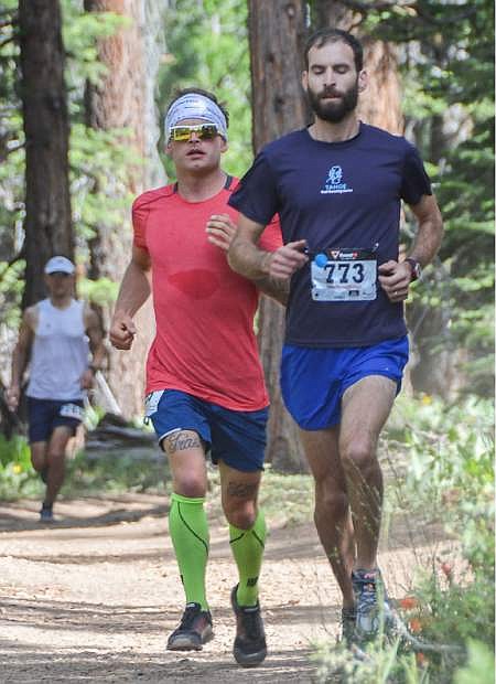 Chris Cloyd of Olympic Valley runs behind James Sullivan of Oakland en route to winning the Burton Creek Trail Run half marathon on Sunday.