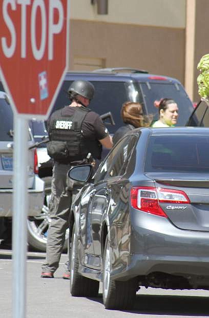 Tri-Net officers detain one female following a drug raid in Carson City Wednesday.