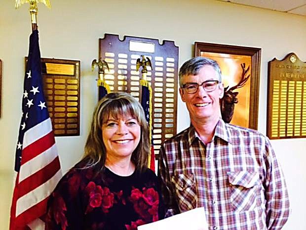 Cynthia Bunt, assistant treasurer of Professional Saleswomen of Nevada, presents a check for $359.50 to Chris Bayer, director of Court Appointed Special Advocates.
