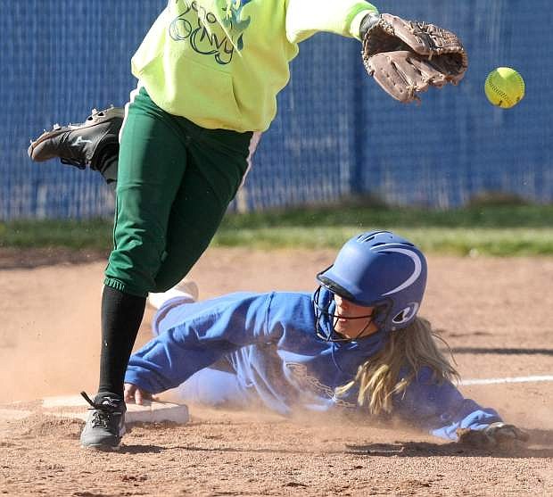 Sara Runge slides into third base in a game against Hug on Tuesday.