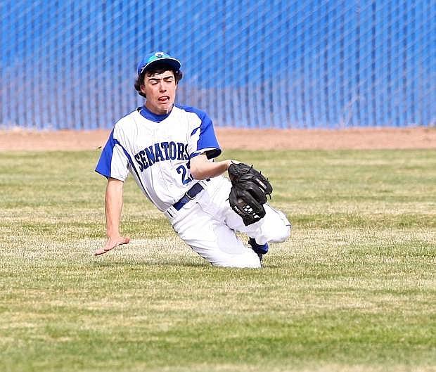 Right fielder Cody Azevedo snags a short fly ball during a game last season.