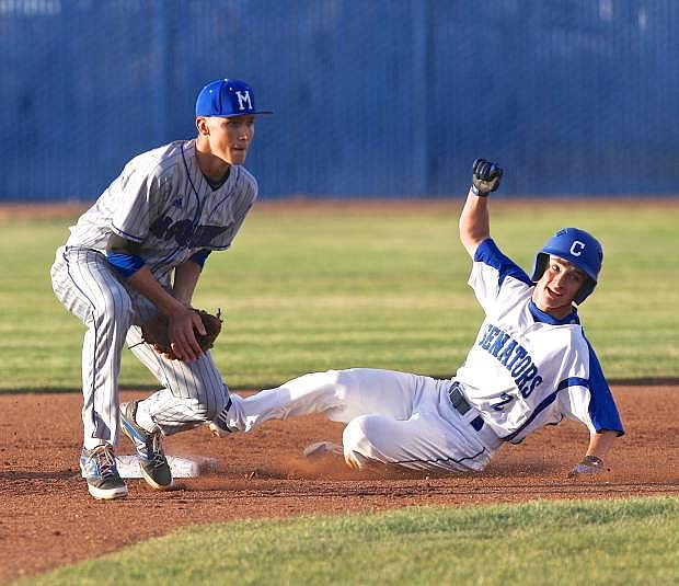 Carson outfielder Jesse Lopez slides safely into 2nd base Thursday in a win over the McQueen Lancers.