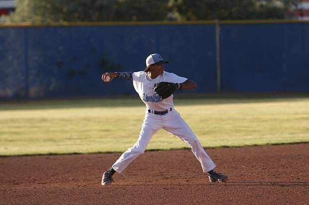 Bluejay&#039;s shortstop Josiah Pongasi makes a throw to first base on Wednesday night in a game against the Douglas Tigers.