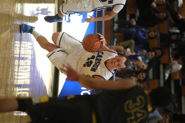 Ian Schulz drives to the basket in a game against Reed on Tuesday.