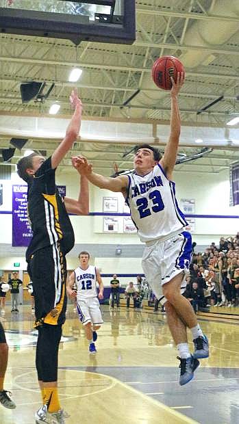 Carson senior point guard Cody Azevedo drives in for a layup at the regional quarterfinals against Galena last week in Sparks.