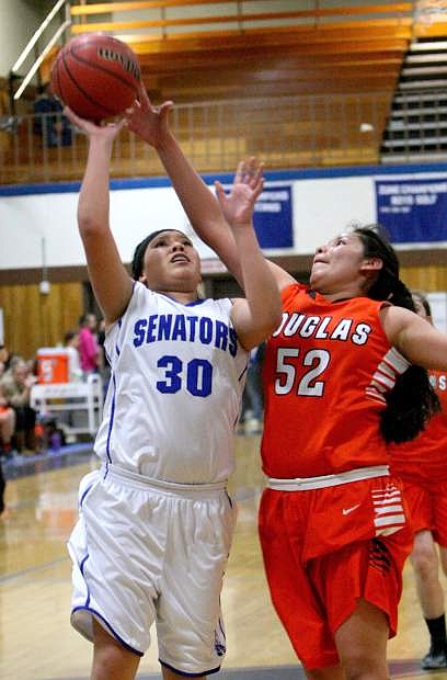 Brianna Alvarado drives to the basket against a Douglas defender on Tuesday night.