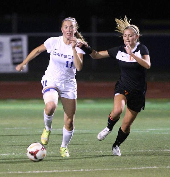 Lindy Lehman brings the ball up the field against Douglas on Tuesday night.