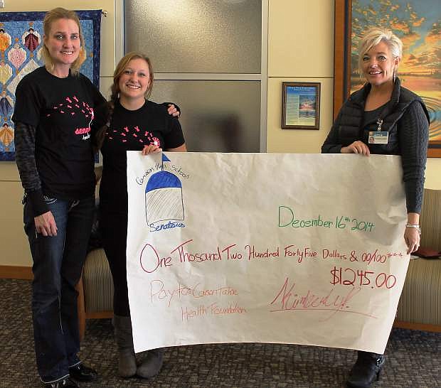 Kimberly Parsons, a Carson High School senior and member of the Key Club, organized and implemented a fundraising campaign for area cancer patients as her senior project, in which she sold cancer awareness-themed T-shirts, wristbands and baked goods, raising a total of $1,245, which she presented to Carson Tahoe Health Foundation on Tuesday.