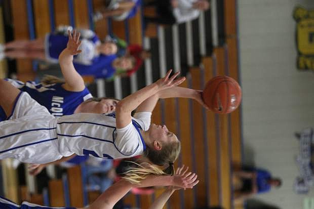 Carly Bachmann drives past a McQueen defender for a basket on Tuesday.