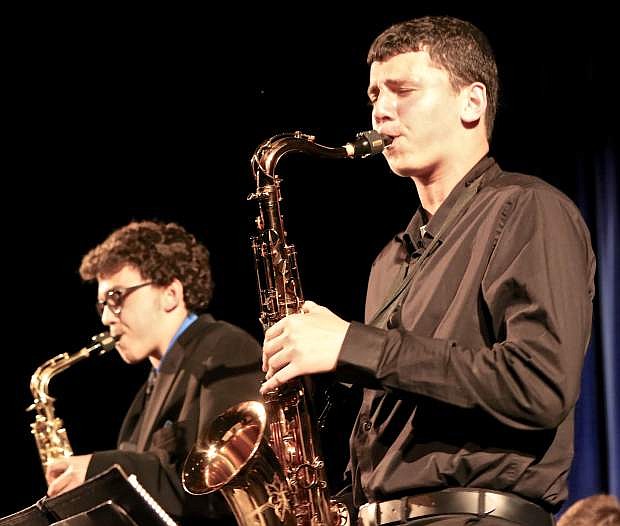 A pair of saxophone players perform solos Wednesday night during Carson High&#039;s &#039;An Evening With The Classics&#039; at the Carson Community Center.