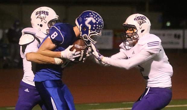 Connor Pradere secures a 22-yard touchdown pass from quarterback Joe Nelson in the second half of Friday&#039;s playoff opener against Spanish Springs.