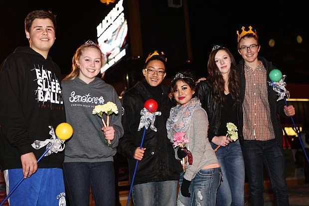 The winter homecoming underclassmen are crowned Friday night at the Arlington Square ice rink. They are (L-R) freshmen Zach Schmidt and Lauren Lumburg, juniors Ojo Ventura and Jocelyn Adrian and sophomores Juliana Williams and Danny Dudley.